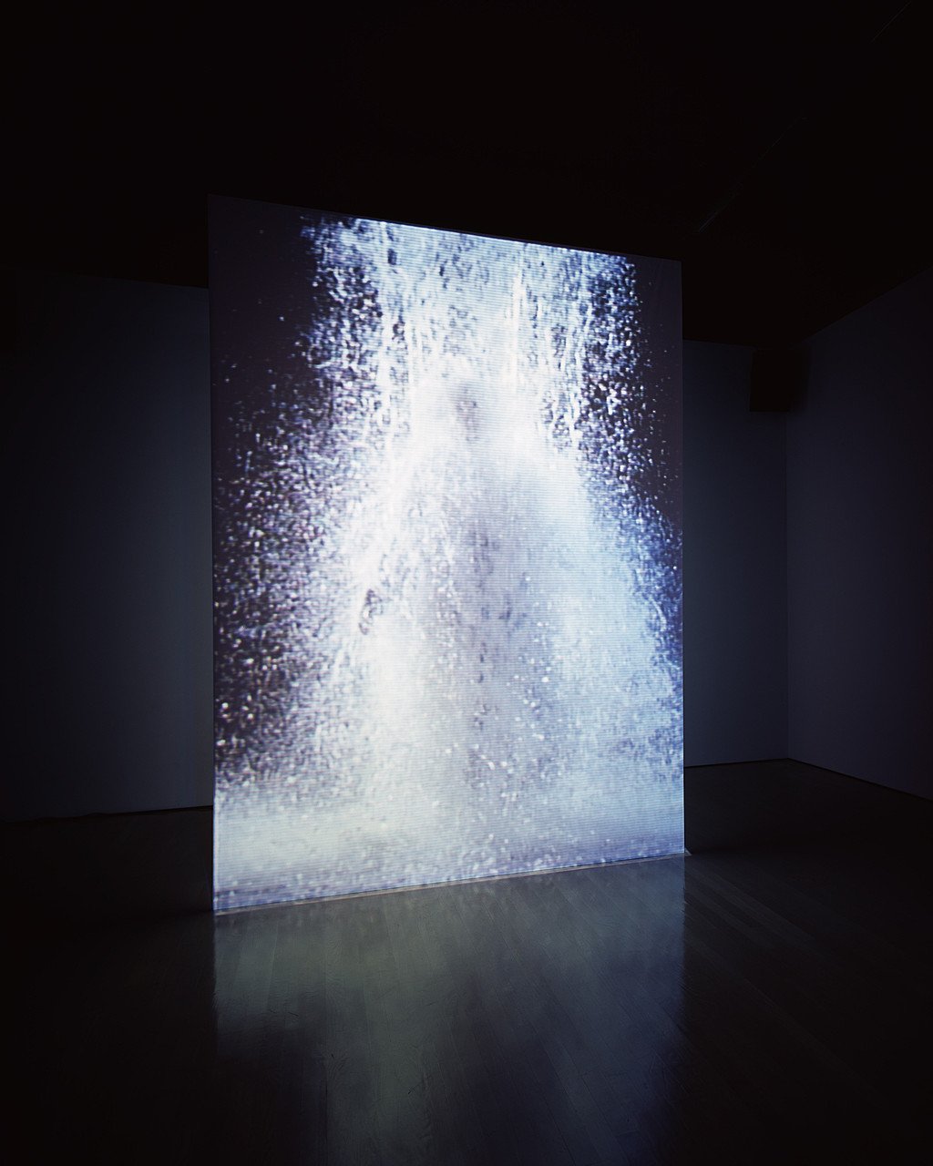Bill Viola, The Crossing: a double sided projection screen, a man engulfed by a torrent of water on one side and by fire on the other