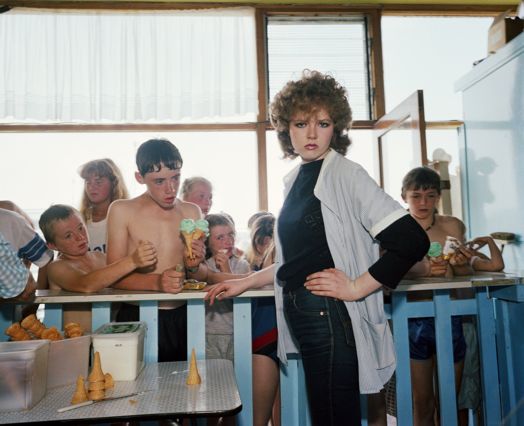 Martin Parr, The Last Resort: a colour flash photograph of holidaymakers on the beach at New Brighton