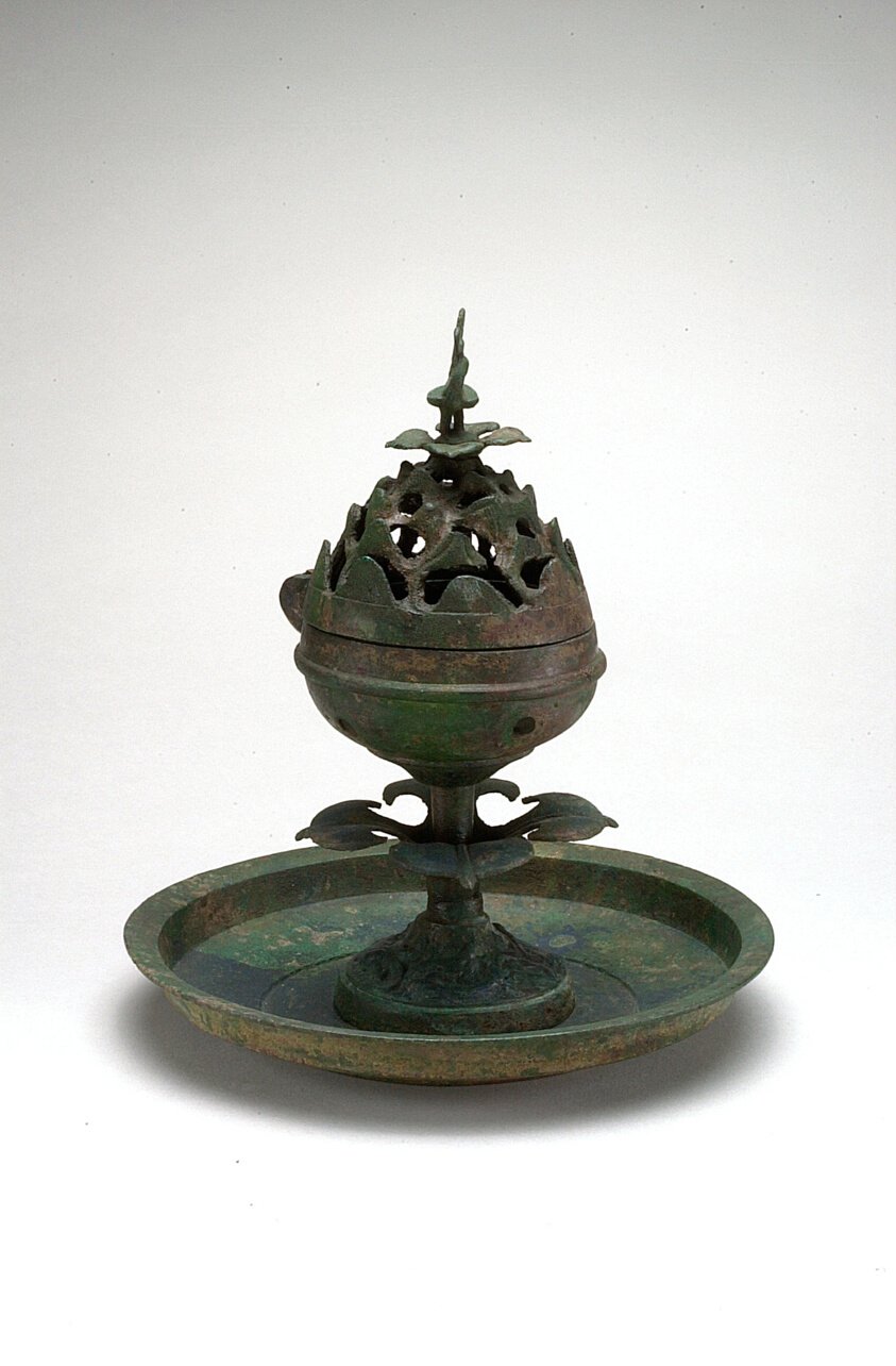 Han dynasty bronze incense burner with a conical lid of pierced mountain peaks