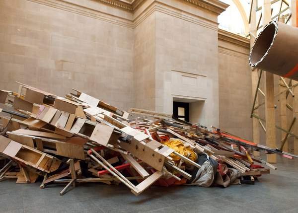 Phyllida Barlow, dock: timber frames, suspended blocks and tarpaulin piled in the Duveen Galleries, Tate Britain