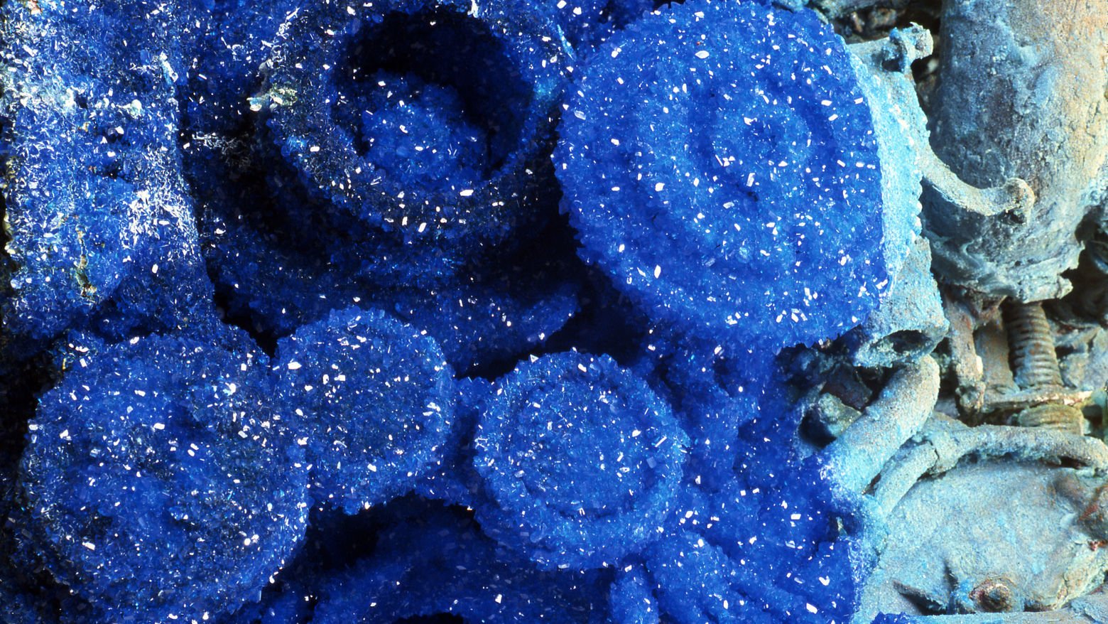 Roger Hiorns at the Hammer Museum: sculpture covered in blue copper sulphate crystals beside works using fire and foam