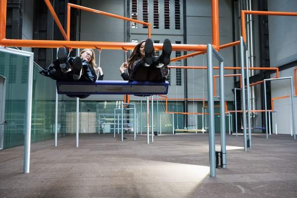 SUPERFLEX, One Two Three Swing!: an orange steel line with three person swings in the Turbine Hall